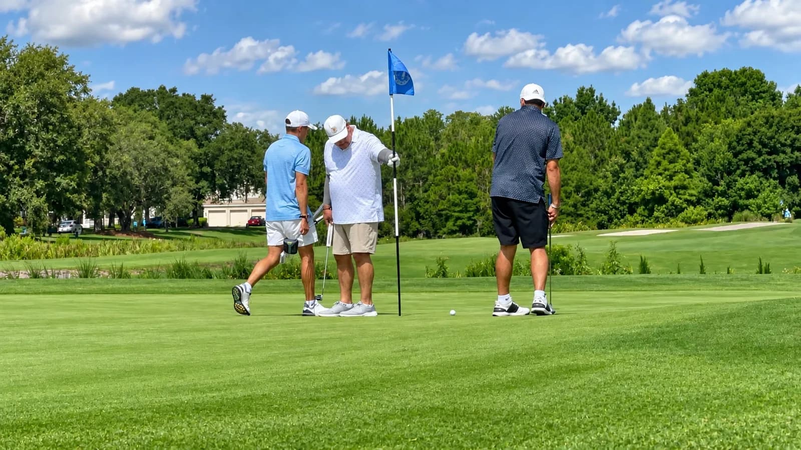 The family on the green around the flag during a round